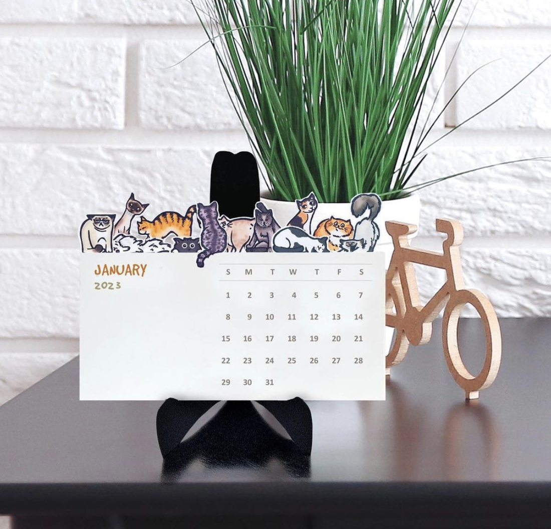 Illustrated desk calendar with cats