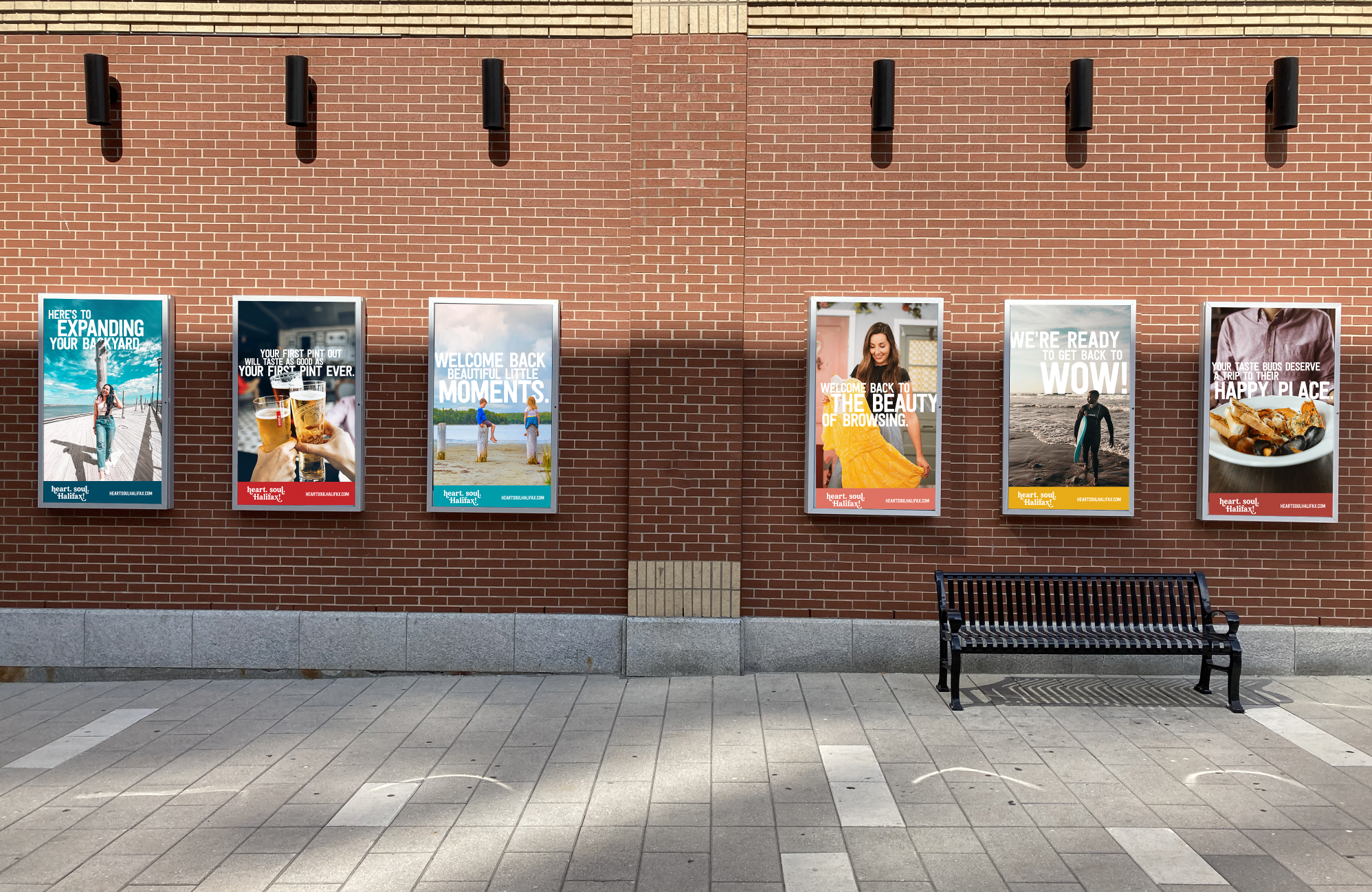 6 of Discover Halifax's 'heart. soul. Halifax!' colourful campaign posters on display on Argyle Street brick wall