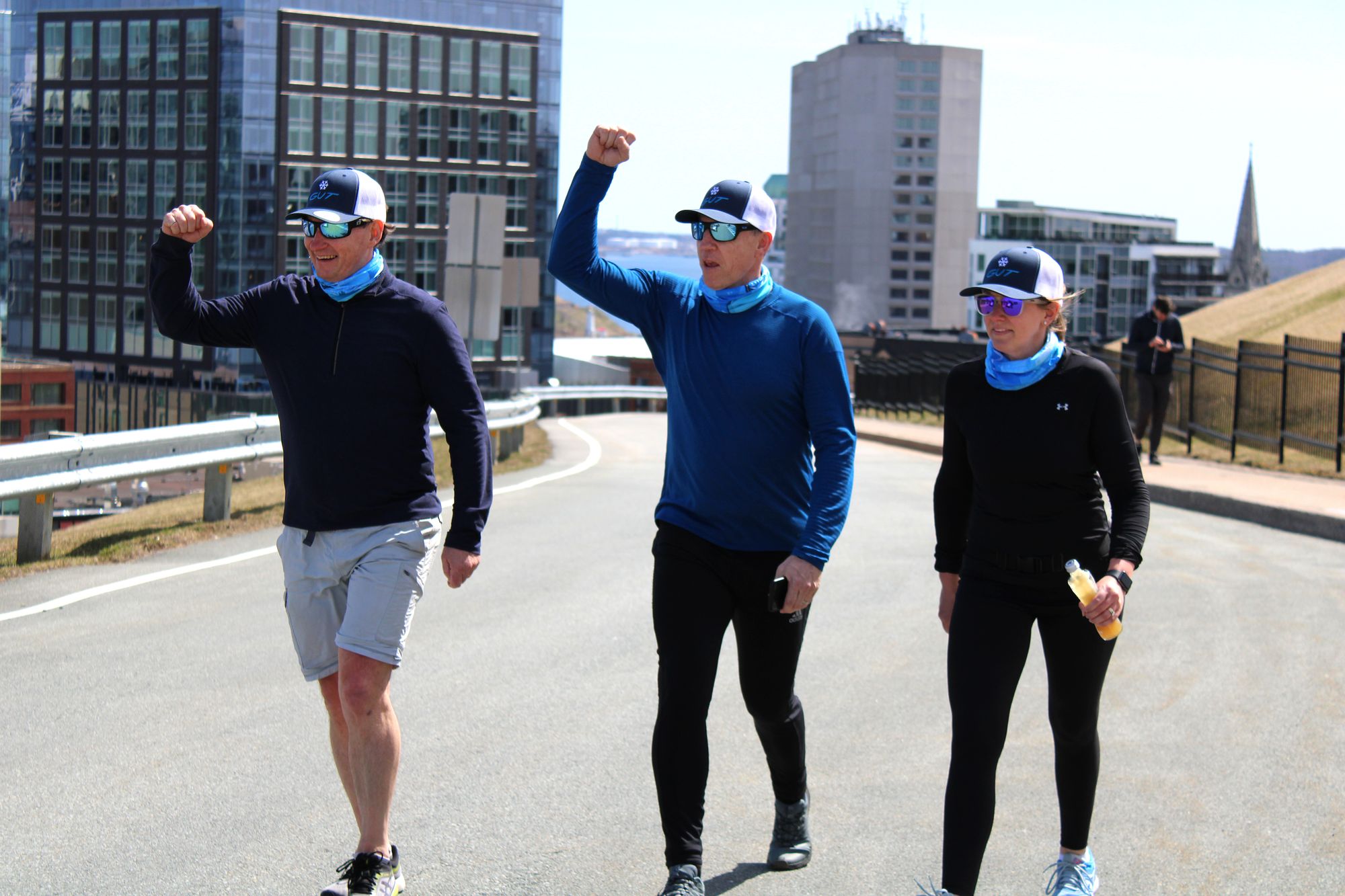 Mark Gascoigne and team members celebrating on top of Citadel Hill in GUT gear